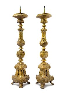 A Pair of Neoclassical Brass Prickets Height 33 1/2 inches.