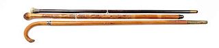 * A Collection of Three Canes Length of first 33 1/4 inches.