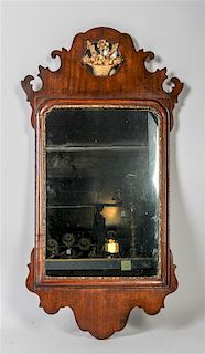 An English Chippendale Style Mirror Height 31 1/2 x width 16 1/2 inches.