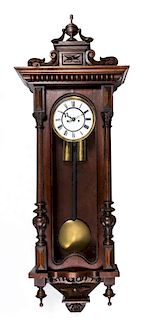 A Victorian Walnut Wall Clock Length 40 inches overall.