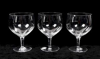 * A Set of Seventeen Baccarat Wine Goblets Height 7 inches.
