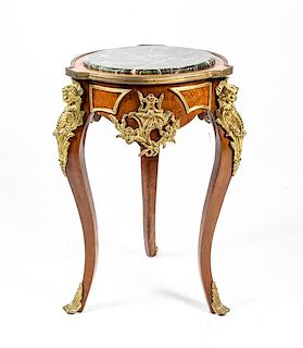 A Louis XV Style Gilt Metal Mounted Table Height 33 x diameter of top 21 1/4 inches.