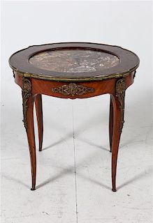 * A Louis XV Style Marquetry Decorated Side Table Height 22 1/2 x diameter 24 inches.