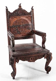 An Anglo-Indian Carved Teak Armchair Height 45 inches.