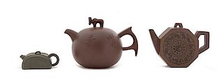 * Three Yixing Teapots Height of largest 4 inches.