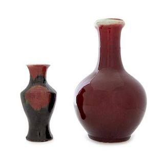 Two Chinese Red Glazed Porcelain Vases Height of taller 13 3/4 inches.