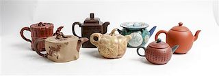 Seven Chinese Yixing Pottery Teapots Height of tallest 5 1/4 inches.