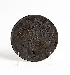 * A Japanese Bronze Mirror Diameter 5 1/2 inches.