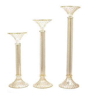 A Set of Three Murano Studio Glass Candlesticks, Height of tallest 24 1/8 inches.