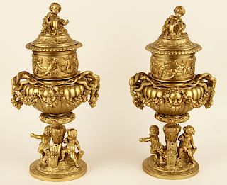 PAIR BRONZE BAROQUE STYLE URNS WITH PUTTO FIGURES
