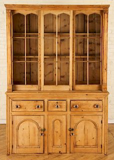A 19TH CENTURY PINE CABINET IN TWO PARTS