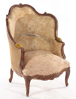 A FRENCH LOUIS XV CARVED WALNUT BERGERE C. 1880