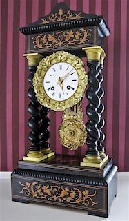 An Empire Style Marquetry Portico Clock, Height 17 1/4 x width 8 3/4 x depth 5 inches.