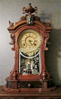 A Victorian Mantel Clock, Height 24 x width 15 1/2 x depth 5 3/4 inches.
