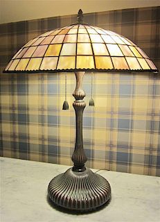 A Leaded Glass Table Lamp, Height 23 x diameter of shade 18 inches.