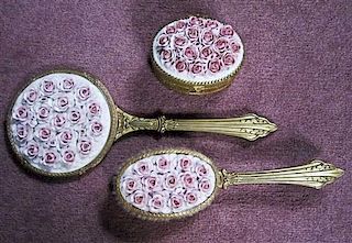A Gilt Metal and Porcelain Dresser Set, Length of mirror 12 5/8 inches.