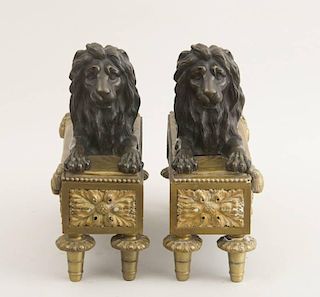 PAIR OF LOUIS XVI STYLE BRONZE AND GILT-BRONZE LION-FORM CHENETS