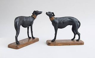 PAIR OF ENGLISH CARVED AND EBONIZED WOOD MODELS OF GREYHOUNDS