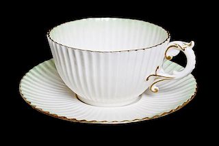 A Belleek Teacup and Saucer, Diameter 5 inches.