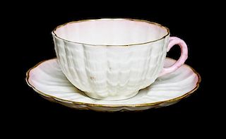 A Belleek Limpet Teacup and Saucer, Diameter of saucer 5 1/4 inches.