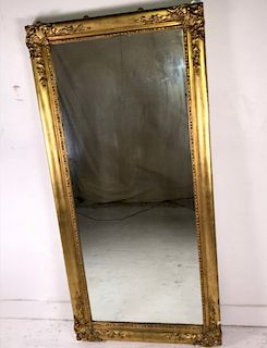LARGE FRENCH OGEE SHAPED CARVED GILT WOOD MIRROR
