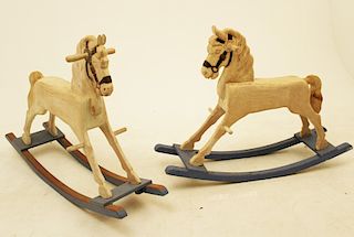 TWO NATURAL CARVED WOOD ROCKING HORSES