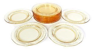 A Set of Thirteen Amber Glass Dessert Plates, Diameter 7 3/8 inches.