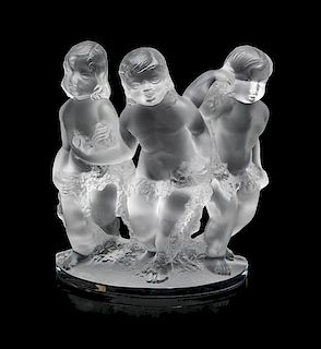 A Lalique Molded and Frosted Glass Figural Group Height 7 1/2 inches.