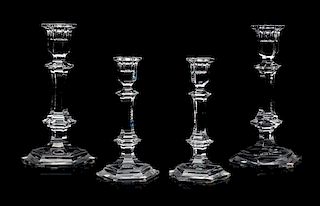 Four Baccarat Candlestick Holders Height of tallest 8 7/8 inches.
