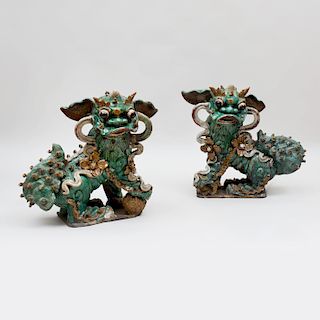 Two Similar Large Chinese Glazed Pottery Buddhistic Lions