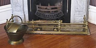 A Brass Fireplace Fender, Height 9 3/4 x width 54 1/2 x depth 14 inches.