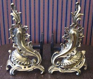 A Pair of Rococo Style Gilt Bronze Chenets, Height 16 x width 9 x depth 19 inches.