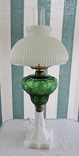 A Green Glass Oil Lamp, Height 25 inches.