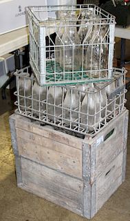 collection of 60 glass milk bottles and crates