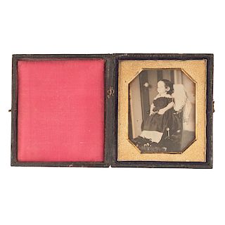 Striking Postmortem Daguerreotype of a Young Girl in a Chair with Flowers