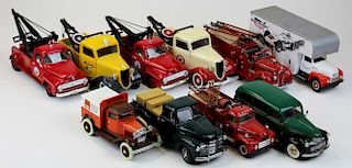 ten diecast trucks, tow trucks, fire trucks