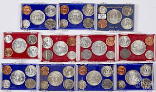 Eleven pre-1964 US coin year sets.