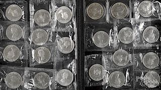 Twenty-two 1964 Canada silver dollars.