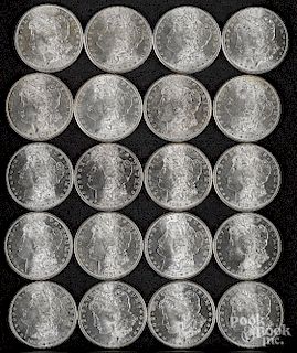 Roll of twenty 1881 S Morgan silver dollars.