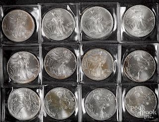 Eighteen American Eagle 1 ozt. fine silver coins.