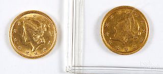 Two US one dollar Liberty head gold coins.