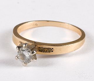 14K gold diamond solitaire ring.