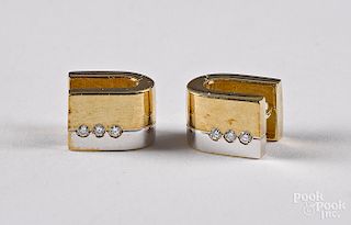 Pair of 14K gold and diamond clip on earrings.