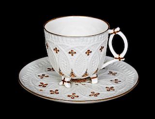 A Belleek Lace Teacup and Saucer, Diameter of saucer 4 7/8 inches.