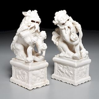 Pair Chinese Dehua style porcelain Foo lions