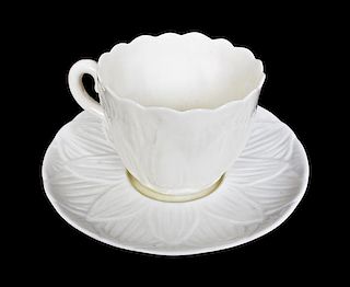 A Belleek Lily Teacup and Saucer, Diameter of saucer 4 3/8 inches.