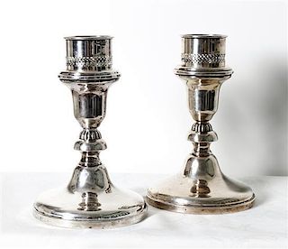 A Pair of Silver Short Candlesticks, Height 7 1/4 inches.