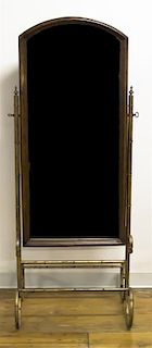 A Brass and Walnut Cheval Mirror, Height overall 63 inches.