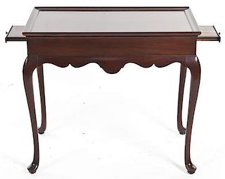 A Queen Anne Style Mahogany Center Table, Height 26 x width 30 1/2 x depth 19 inches.
