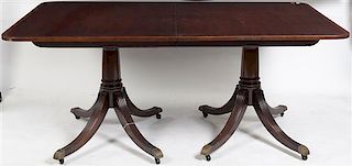 An American Georgian Style Double Pedestal Table, Baker, Height 28 1/2 x width 68 1/2 x depth 44 1/2 inches (closed).